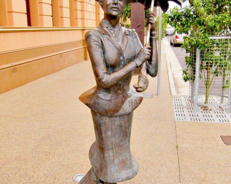 Bronze Statue ofMary Poppins on the footpath in Maryborough Queensland