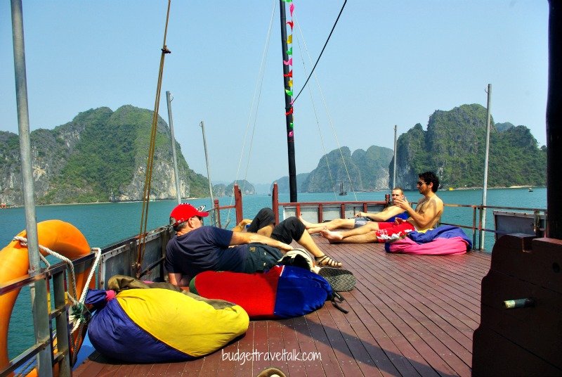Relaxing in bean bags on top deck returning to Cat Ba island.