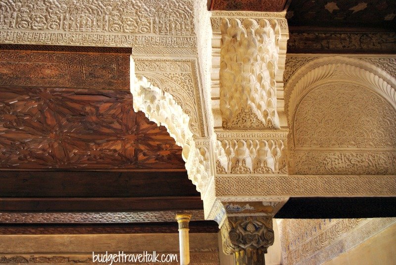 The carved ceiling and intricate details of the Mexuar ceiling. The entrance point of the three palaces
