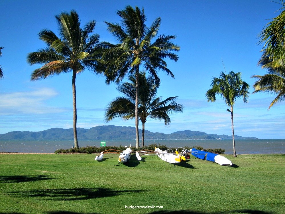 Outrigger Canoes on the Strand with Magnetic Island in the Background