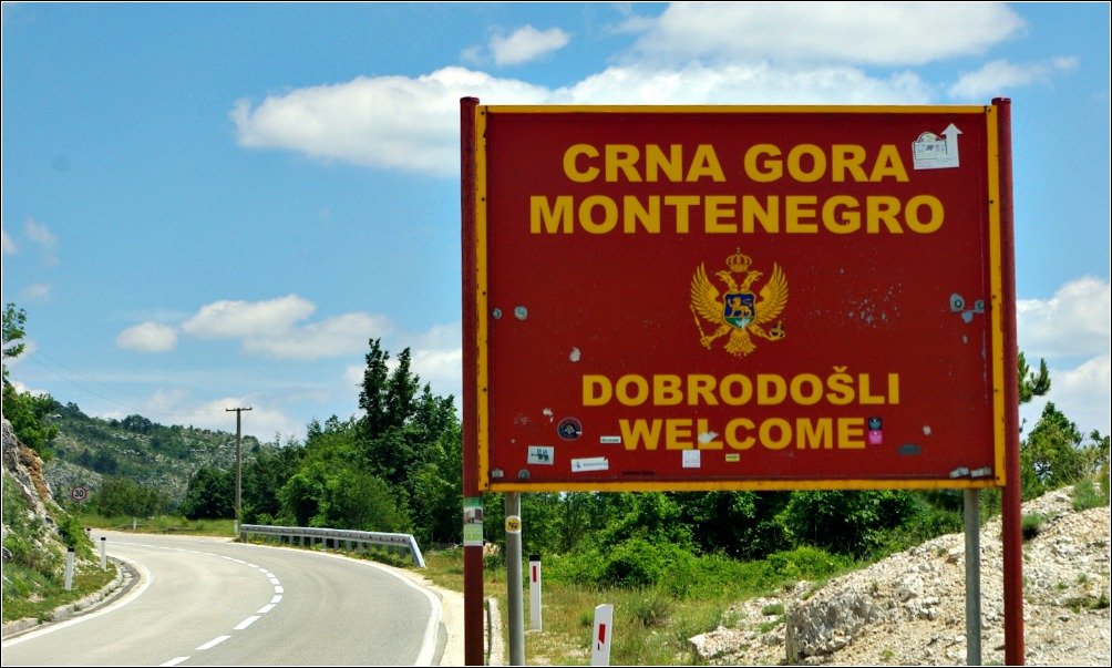 Welcome to Montenegro sign at Ilijino Brdo between Zupa in Croatia and Vilusi in Montenegro