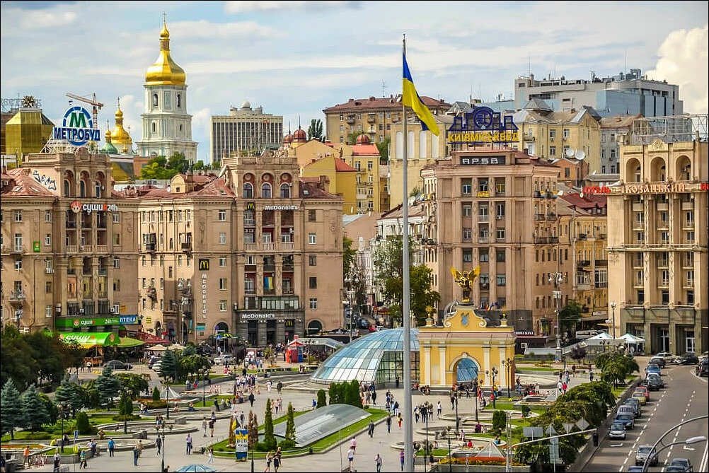 An city view of Kiev Ukraine with clay coloured multi-storey buildings and gold domes