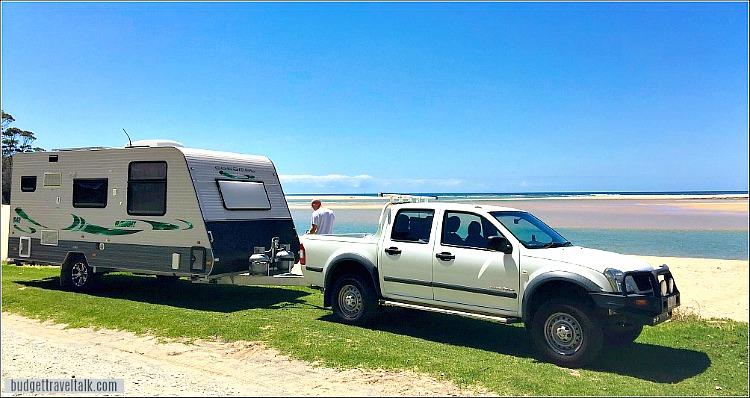 A Coromal Caravan and tow vehicle used for free camping parked by the ocean inlet at Durras North New South Wales Australia