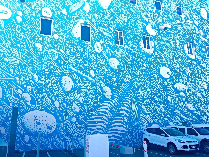 Blue and White Street Art by Tellas on Federation House wall Townsville