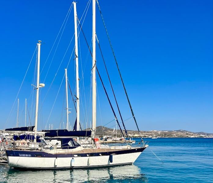 Sailing boat moored in blue sea